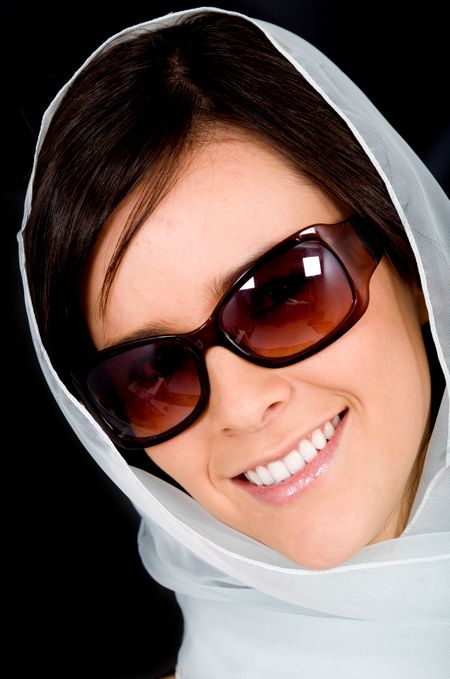 fashion woman portrait where she is smiling and wearing sunglasses