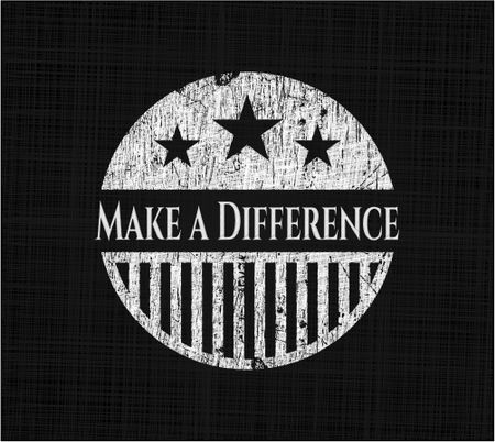 Make a Difference chalk emblem written on a blackboard