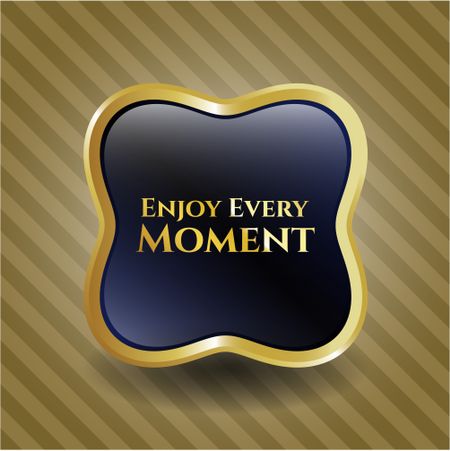 Enjoy Every Moment gold emblem or badge