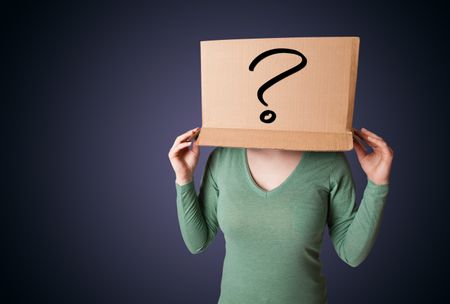 Young lady standing and gesturing with a cardboard box on her head with question mark