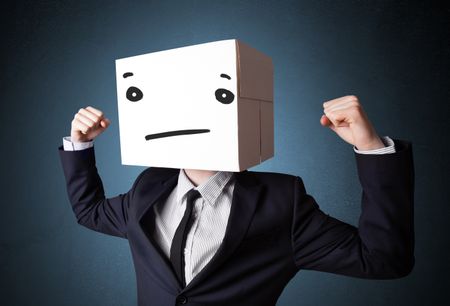 Businessman standing and gesturing with a cardboard box on his head with straight face