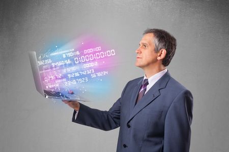 Attractive businessman holding notebook with exploding data and numbers