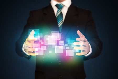 Businessman holding abstract glowing icons