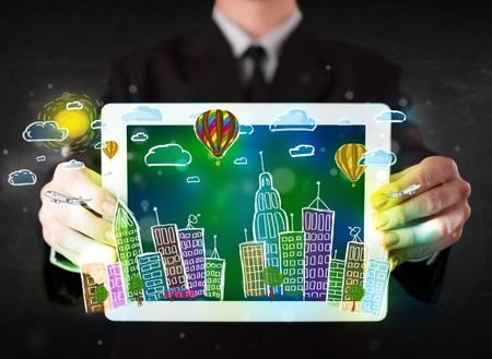 Young person showing tablet with hand drawn colorful cityscape