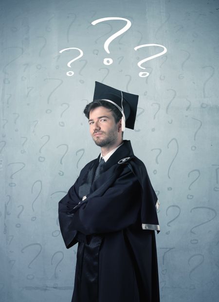 Young graduate teenager with question marks drawn over his head