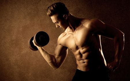 muscular-fit-bodybuilder-athlete-lifting-weight-363185930 Muscular fit bodybuilder athlete lifting weight on grungy background