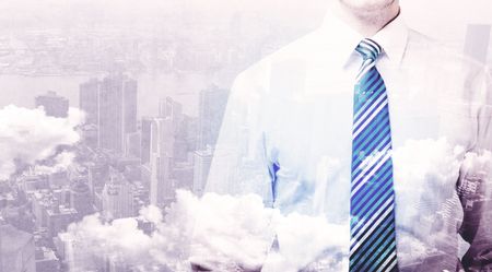 Business man standing at city overlay view background 