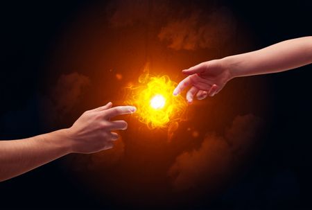 two-naked-male-hands-touch-lighting-363194387 Two naked male hands about to touch, lighting a bright flame with smoke in red sky background concept