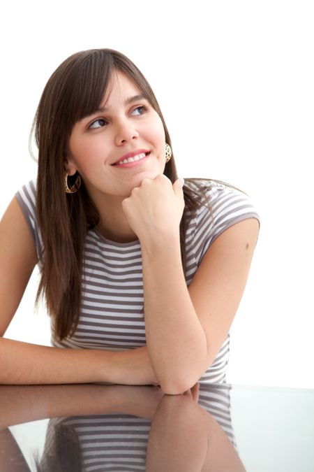 Girl leaning on a desk isolated over white