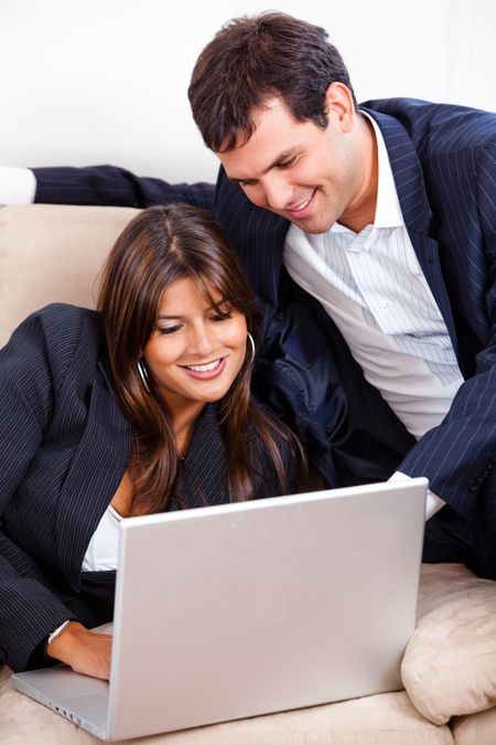 Business couple working on a laptop computer
