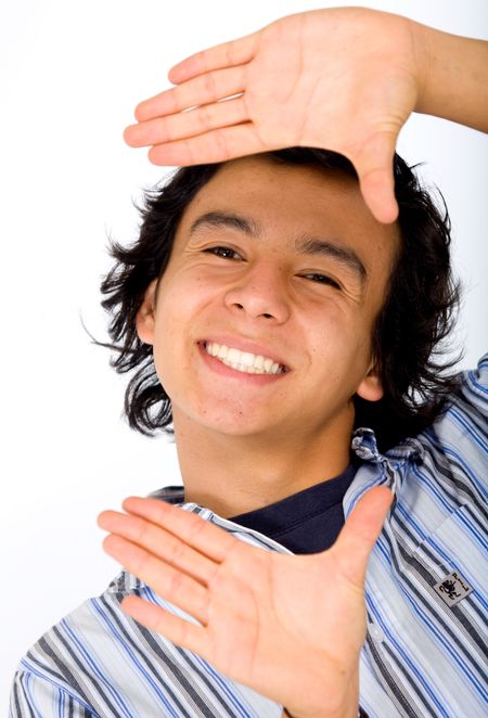 casual man doing a handframe over a white background
