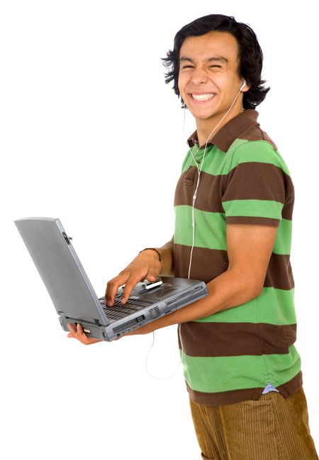 casual man happy downloading online music for his mp3 player over a white background