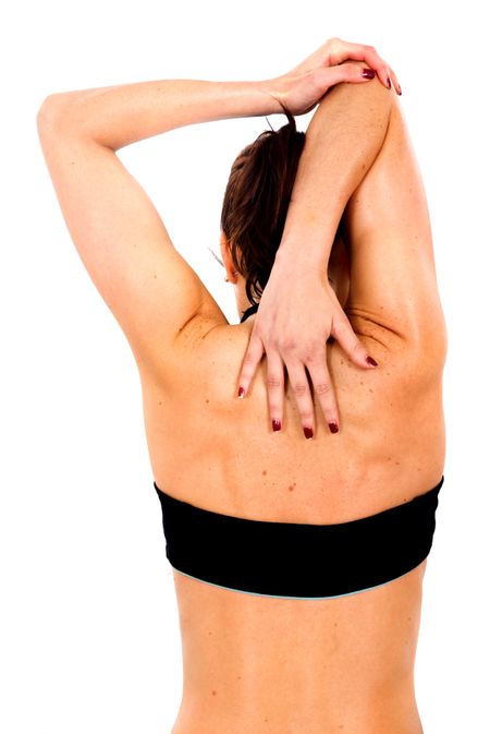 girl stretching before exercising in the gym - isolated over a white background