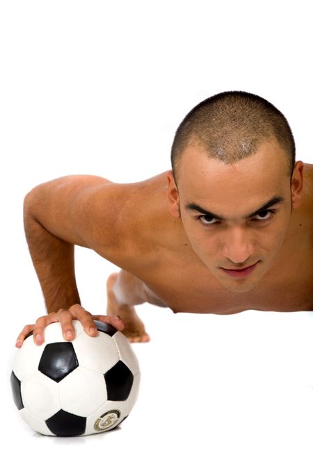 man doing push ups on a football ball over a white background