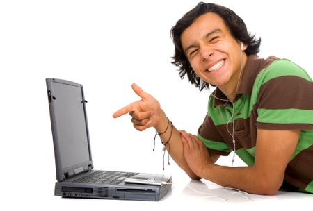 casual man happy downloading online music for his mp3 player over a white background