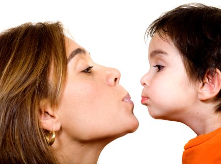 mother and son about to kiss - isolated over white