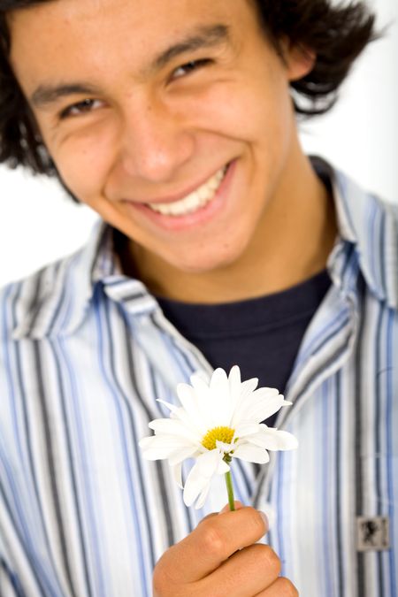 young man in love holding a flower - focus is on flower