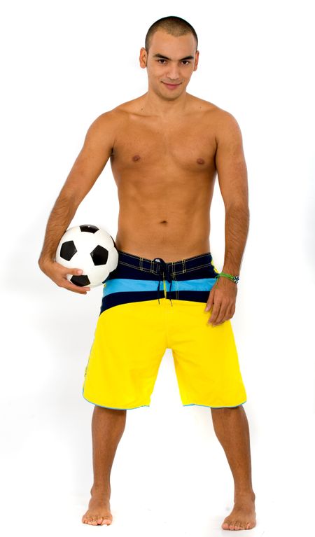 fitness male portrait with a football ball over a white background