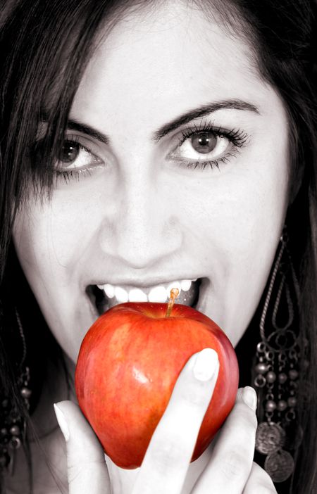 fashion girl eating apple in black and white
