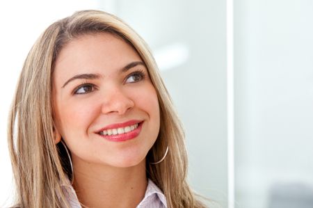 Business woman portrait in an office smiling