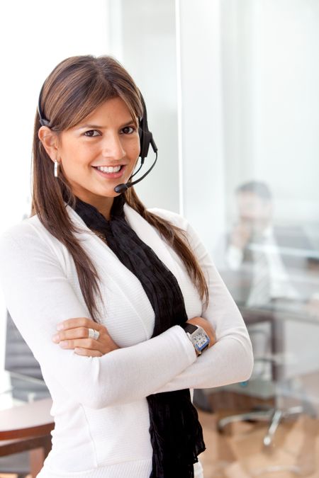 Business woman in an office with headset