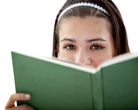 Girl covering her face wih a book isolated