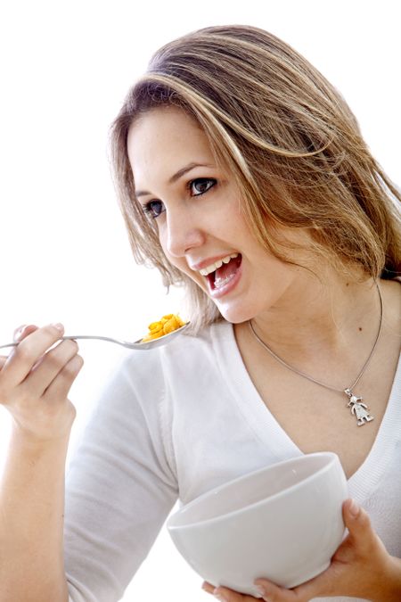 Beautiful woman eating her breakfast isolated over white
