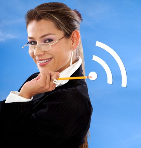 Portrait of a business woman with a pencil over a blue background