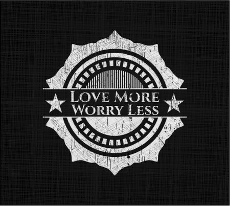 Love More Worry Less chalkboard emblem written on a blackboard