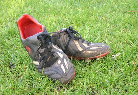pair of football boots after a match