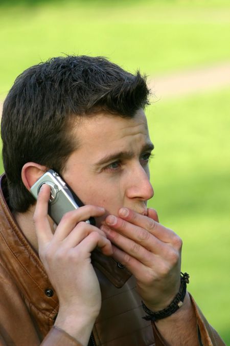 casual man worried on his mobile phone