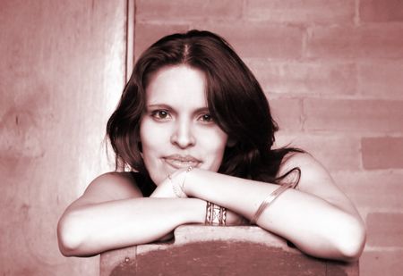 female woman sitting on a chair smiling