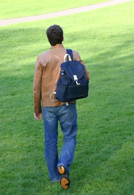 university student having a walk in the park