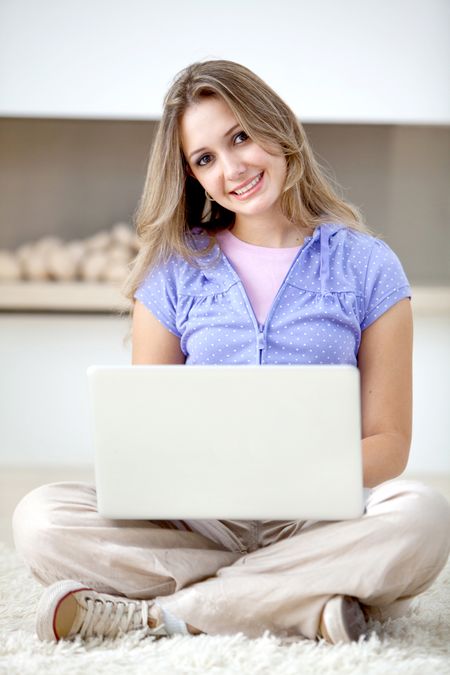 Beautiful woman with a computer on her lap