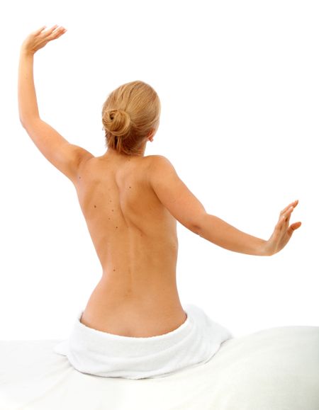 Half-naked woman waking up isolated over white