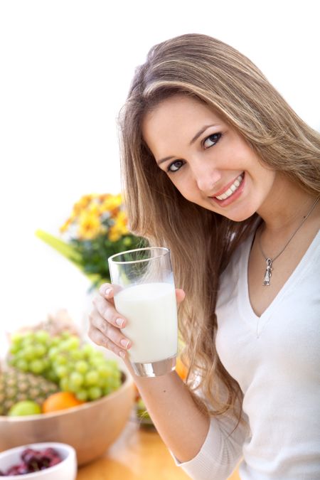Healthy eating woman with a glass of milk isolated