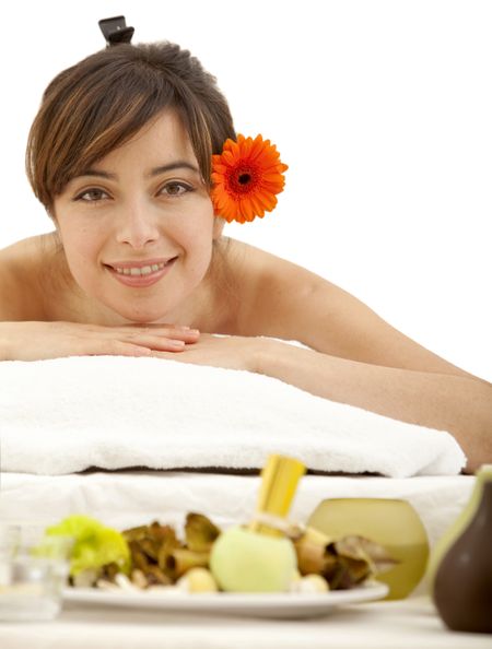 Woman at a spa with a flower on her head