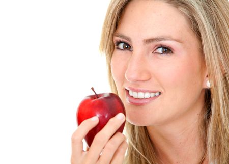 Beautiful woman portrait with an apple isolated over white