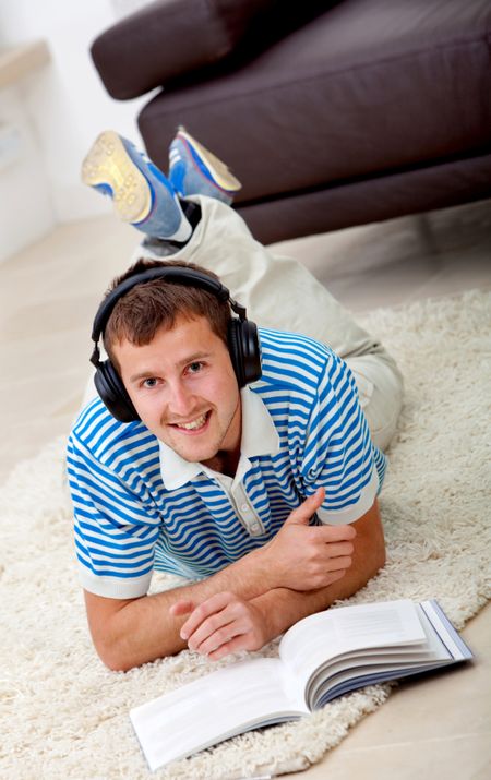 Casual man studying and listening to music