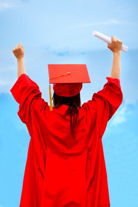 Excited female graduate with her arms outstrethed