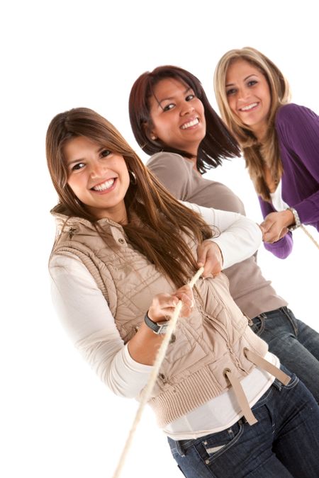 Group of girls pulling a rope isolated over white