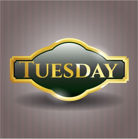 Tuesday golden emblem or badge