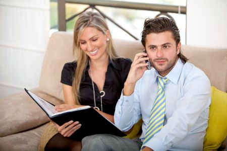 Young business couple in an office working