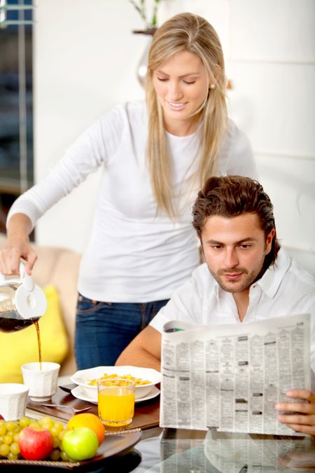 Woman serving breakfast to her partner at home