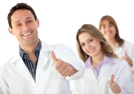 Group of doctors with thumbs-up isolated on white