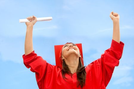 Happy woman smiling celebrating her graduation outdoors