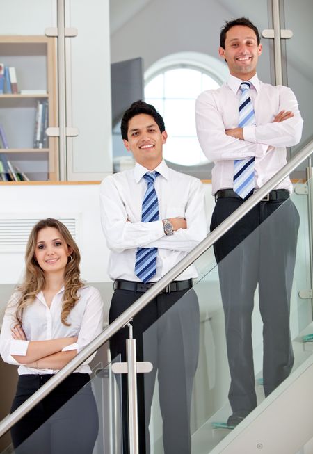 Young business team in an office smiling