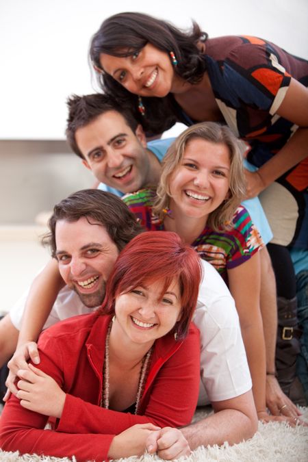 Happy group of friends lying on the floor