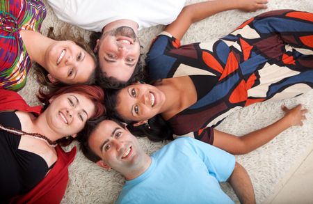 Group of people with heads together on the floor