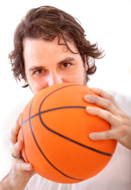 Man covering his face with a basketball isolated